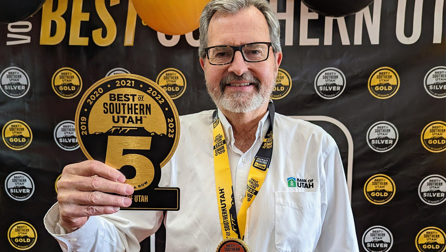 Thomas Rutter holds Best of Southern Utah 5 year award