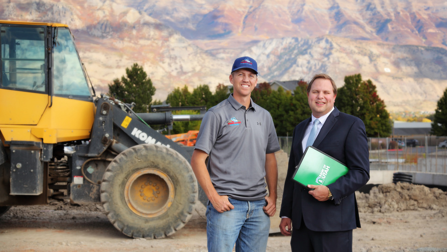 Tagg N Go's Conner Atkin and Bank of Utah's Mike Wells stand on the site of what will be a new Tagg-N-Go car wash in Utah County