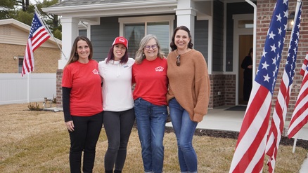 Bank of Utah's Linda Rose and team stand outside the 2025 Have a Heart Home project